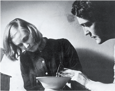 Watched by Hermia, David applies a ‘fin’ or profile implement to spinning clay at their Greenwich pottery, 1953 photo: The Pottery and Ceramics of David and Hermia Boyd by John Vader, page 46