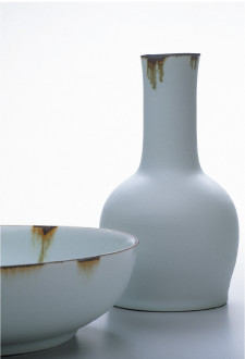 Vase and Bowl, 2005, porcelain, matt white glaze, with banded iron rim, reduction fired, bowl h.7.5cm, d.26cm, vase h.24cm. Photo: Grant Hancock