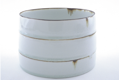 Bowl, 2005, porcelain with matt white glaze, bands of iron oxide, reduction fired, h.14.5cm, d.19cm. Photo: Jim DeGregorio